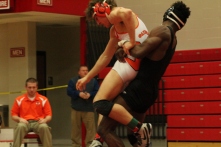 Regional champion Josh Cooper goes for a throw during a winning effort in the regional final for the 152 weight class.