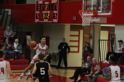 Gabe Gallahar tries to make the layup over the defender.