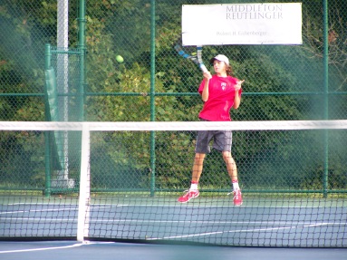 Senior Jerid Inman returns floyds serve with a forehand Thrusday afternoon at the Foldy match