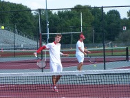 Junior Blake Winchell hits a volley before the jeffersonville Invite begins