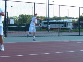Freshman Bryce Vernon hits a forehand in warm ups Friday afternoon before the Jeffersonville invite