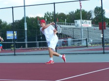 Sophomore Gavin Lone hits a forehand to Junior Jared wells during warm ups alongside his partner Kyle Lemon