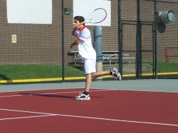 Junior Juan hits a forehand to Sophomore Evan in warms up Friday afternoon before the Jeffersonville Invite