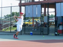 Freshman Charley Williams hits a backhand in a rally Friday night