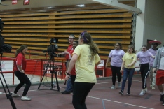 Ellie Melin dances over to some of the WJHI student journalists.